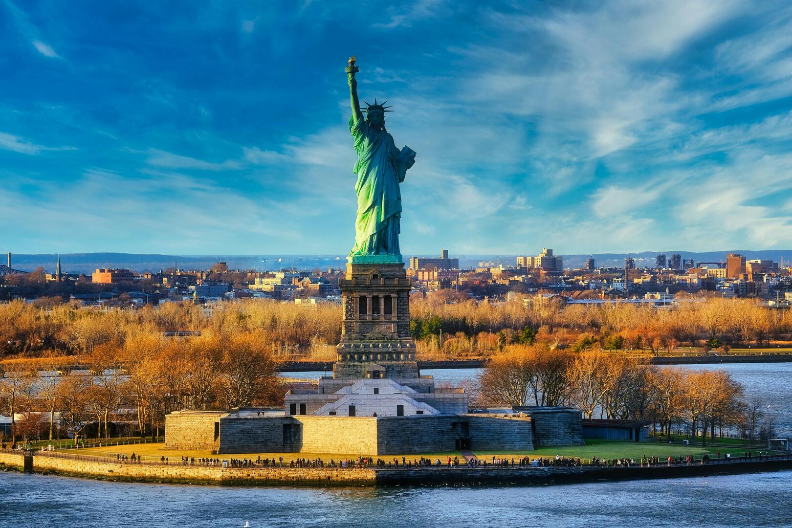 Statue of Liberty torch with breathtaking New York Harbor panorama